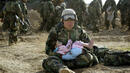 <p> </p>
<p style="margin-bottom: 0cm;"><span>Войник спасява дете, което се е отделило от семейството си по време на престрелка (2003 год.)</span></p>