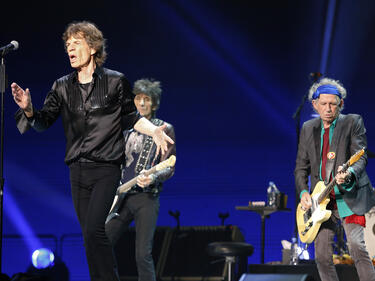 Rolling Stones прежали Лорън Скот