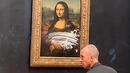 Мъж в инвалидна количка уцели Мона Лиза в Лувъра с торта ВИДЕО